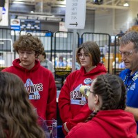 A team meets during the 2026 GVSU West MI District Event